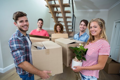 Removal company team handling household items during a professional move