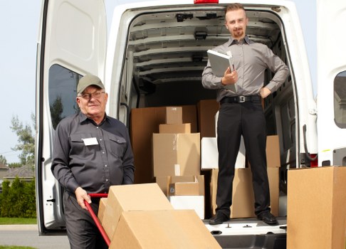 Removal van and moving team in a Marylebone street