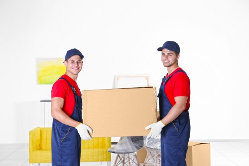 Removal crew loading furniture near a busy Marylebone location