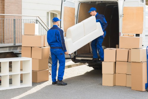 Team handling bulky furniture pick-up in central London