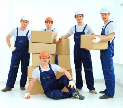 Staff handling furniture carefully during a house removal