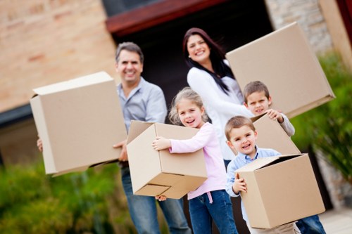 Professional movers handling fragile items in a central London property